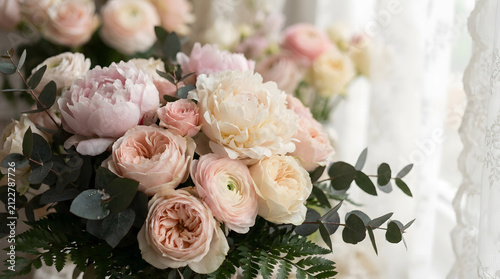 Elegant bouquet of pink peonies and roses close up