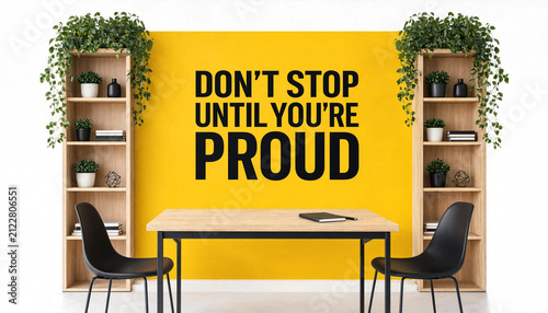 Motivational office space with a table chairs bookshelves and a bold inspirational quote on a yellow wall