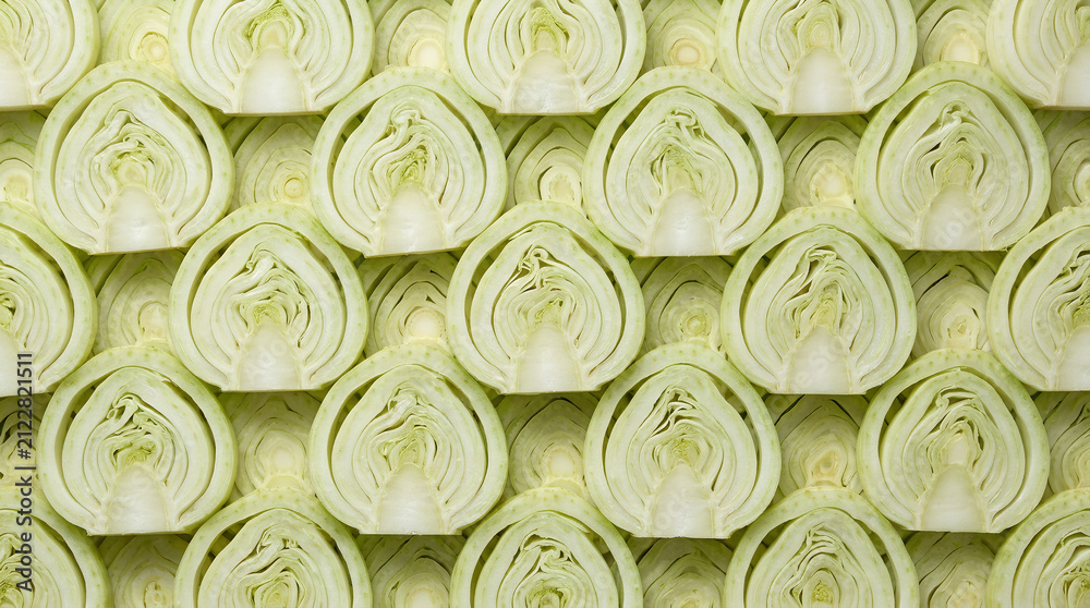 Obraz premium Fennel slices in a flat lay arrangement on a wooden background.