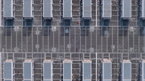 Aerial view of a data center roof with rows of server cooling units 