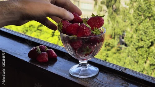Putting strawberries in a vase