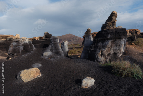 Bild auf Leinwand Layered volcanic rock formations in Lanzarote