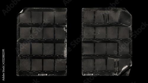 Worn vintage film contact sheet frames isolated on black