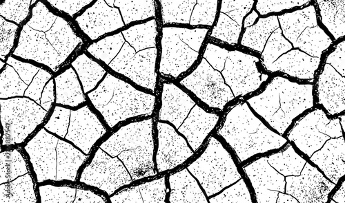 Cracked dry earth texture with deep fissures during drought illustrating arid conditions and environmental hardship