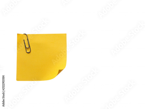 Single yellow sticky note with metallic paperclip attached isolated on transparent background for quick reminders