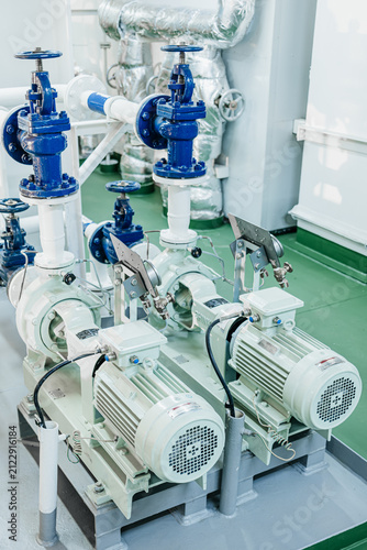 Electric Water Pumps and Control Valves with Pressure Gauges in Ship Engine Room