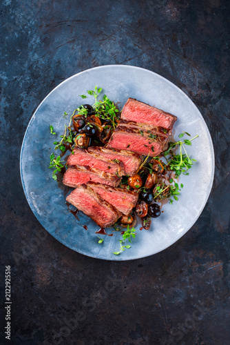 Konstfotografi Traditional barbecue grass-fed dry aged roast beef steak tagliata with grilled m