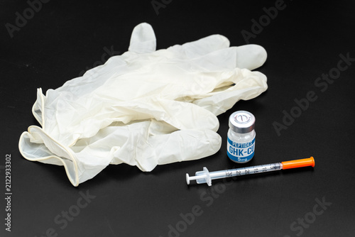 Fotografie Latex Gloves, GHK-CU Peptide Vial and Insulin Syringe on Black Background