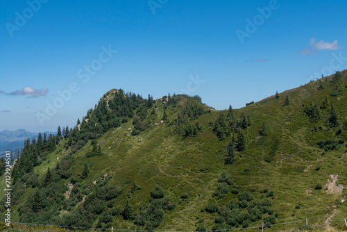 Canvastavla panoramic view of the lush green alpine pastures and rolling mountain slopes of