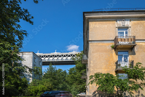 Western High-speed Diameter (ZSD) between residential buildings, close-up. Kanonerskiy Island, Saint Petersburg