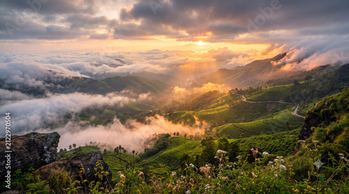 Panoramic Top Station viewpoint overlooking mist-covered valleys, rolling mountains and endless Western Ghats scenery in Munnar Kerala India
