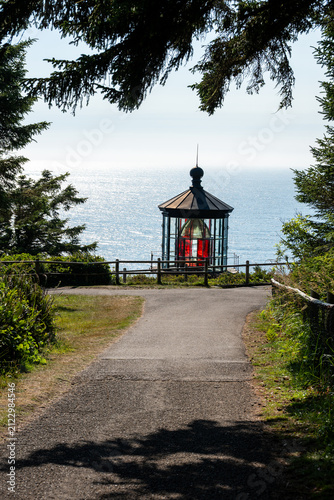 Konstfotografi Trail through woodland forest to lighthouse on headland at Cape Meares National