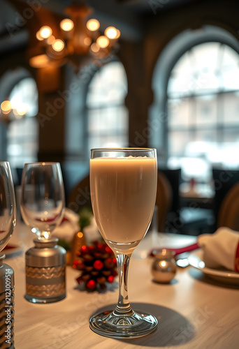Creamy beverage in a wine g...