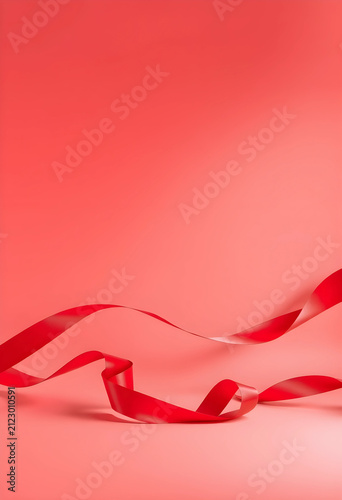 Red satin ribbon flowing gr...