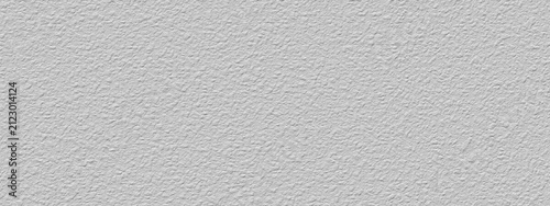 Abstract grey gypsum wall, background - in the form of a rough embossed gypsum surface, closeup