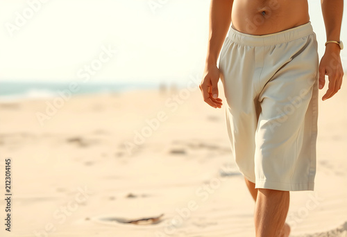 Man walking on a sandy beac...