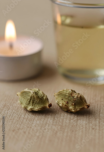 Two green cardamom pods on ...