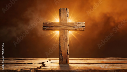 Wooden cross on cracked surface with glowing light
