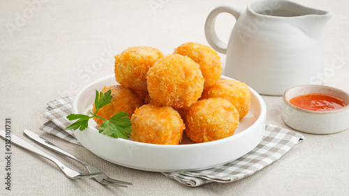 Bild auf Leinwand Crispy Fried Chicken Cordon Bleu Bites on a White Plate