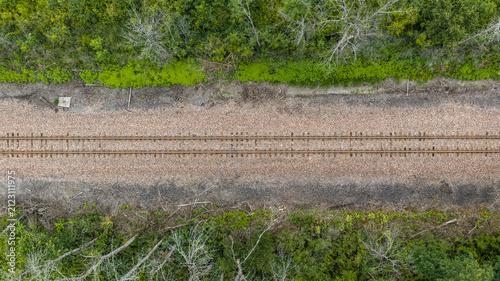 An aerial perspective looking straight down at a railroad track.