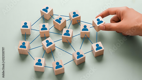 Human connection with wooden blocks and person icon network during concept development