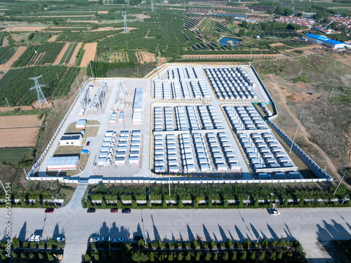 Aerial view of a large-scale energy storage power station with battery arrays and industrial infrastructure