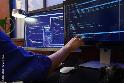Programmer working on multi...