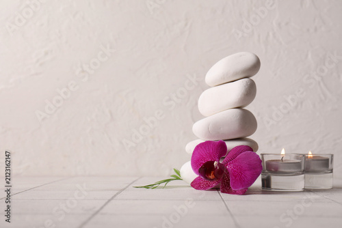 Stacked white spa stones wi...