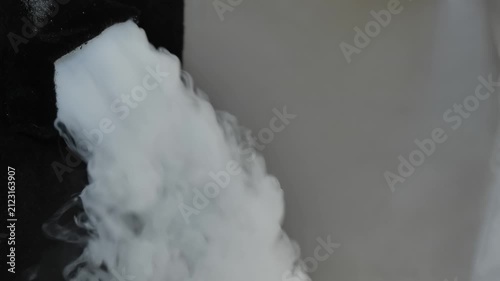 Fog machine emitting heavy smoke creating special effects at a party