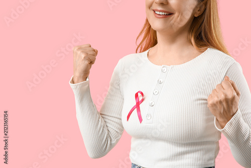 Happy mature woman with pin...
