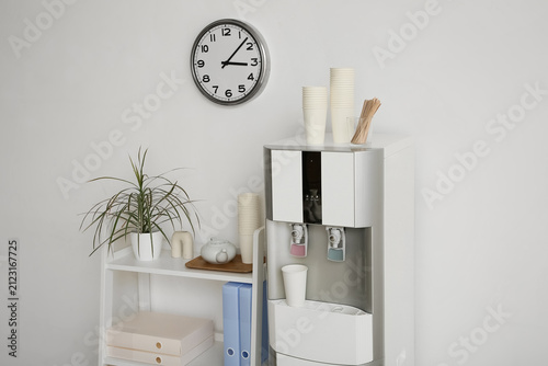 Modern water cooler and she...