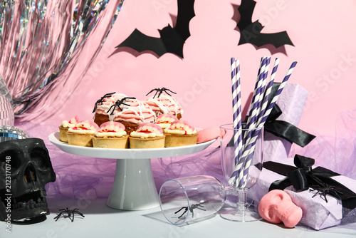 Stand with tasty cupcakes a...
