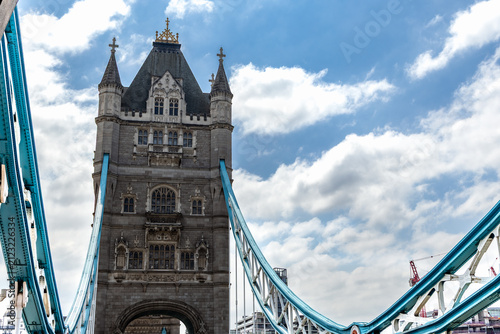 Canvas Print The north tower of Tower Bridge rises above the River Thames beneath dramatic cl