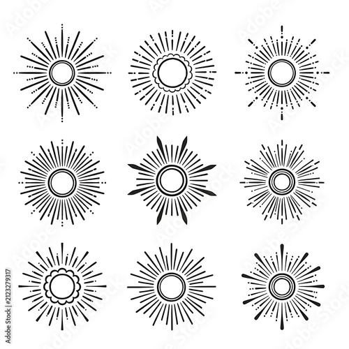 Minimalist sunburst patterns with circular centers in black and white.