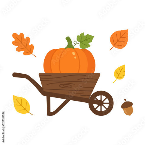 фотографія Orange pumpkin in a wooden wheelbarrow surrounded by colorful autumn leaves and