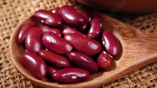 Red beans in a wooden spoon