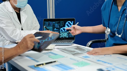 Asian medical team discusses virus research, vaccine development and infectious disease strategy using digital healthcare data during a clinical meeting.