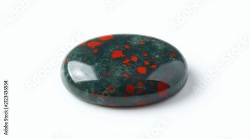 Polished oval dark green gemstone with striking red speckles, a natural mineral cabochon isolated on white background, highlighting its patterns and smooth surface