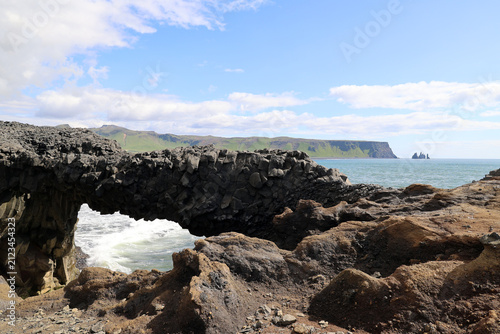 Bild auf Leinwand Rock arch on the Dyrhólaey peninsula – fantastic coastal landscape, Iceland