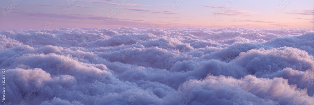 Obraz premium Panoramic aerial view of soft, fluffy clouds bathed in serene pastel pink and purple sunset light, creating a dreamy, ethereal cloudscape.