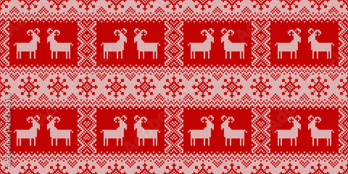 Knitted seamless pattern for 2027 New Year of the Goat. Vector background with stylized goats, snowflakes and abstract ornaments. Red and white sweater print.