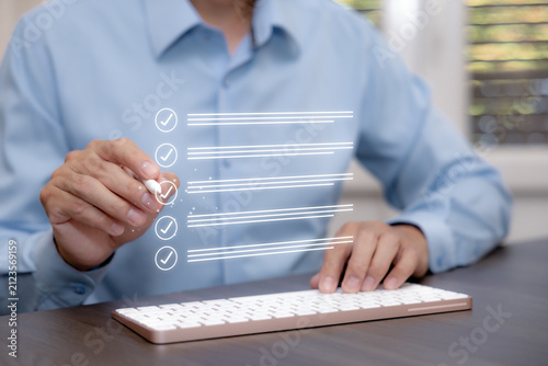 Digital checklist with verified tasks and completion status, representing workflow management, quality control, compliance review and business process improvement.
