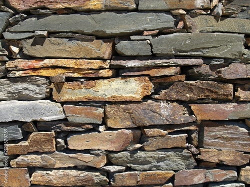 Dry stack stone wall masonry texture background