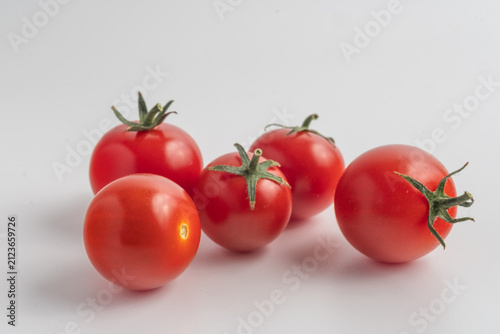 red tomatoes on a white