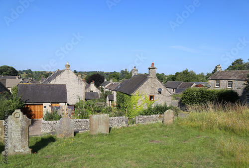 Принти на полотні A view across the village of Hartington in the Peak District,  Derbyshire, England from St