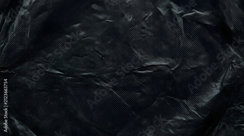 Obraz na płótnie Dark moody black plastic trash bag texture with a subtle dot matrix grid