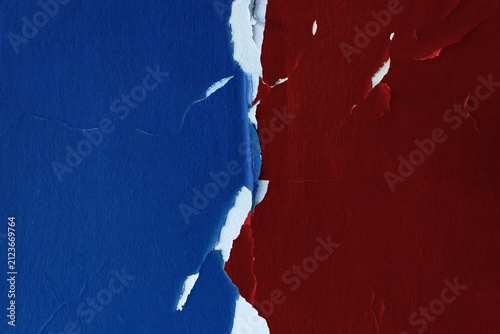 Torn blue and red wall surfaces reveal a white divide, geopolitical conflict
