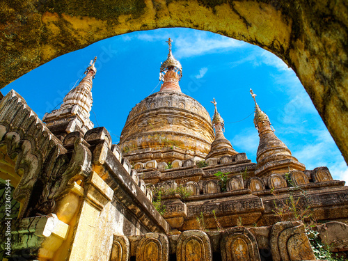 Canvas Print Ancient Bagan temple pagodas rising above the green plains of Myanmar, a UNESCO