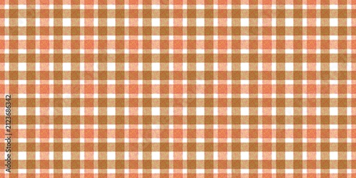 Seamless orange and brown plaid pattern background with woven texture for fabric, tablecloth, and wallpaper design.
