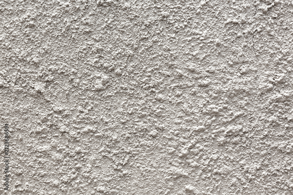 Obraz premium a rough, white concrete plaster wall texture.The material is used for exterior or interior wall decoration and is typically made from cement, lime, and sand.